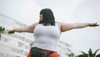 Overweight woman exercising to lose weight